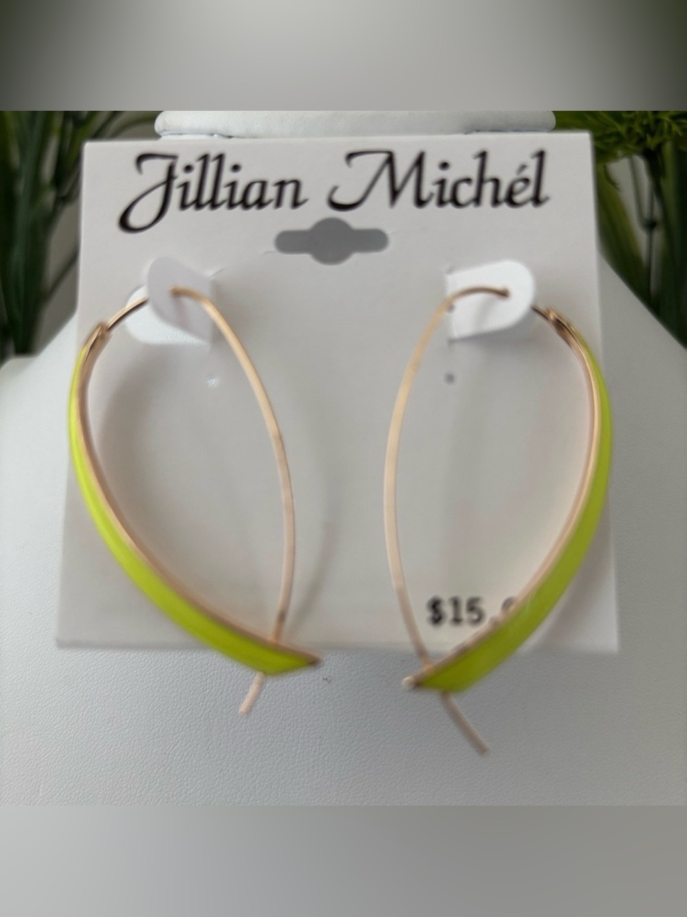 Jillian Michel Elongated curved shaped hoop, neon yellow-green, bold modern